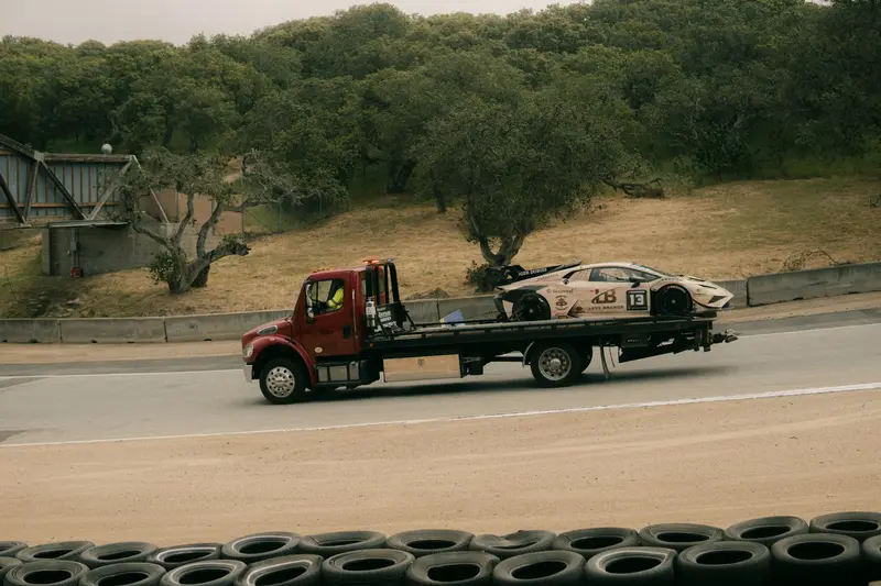 A car arriving on a tow truck in California